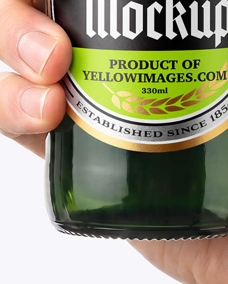 Green Glass Beer Bottle in a Hand Mockup