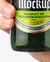 Green Glass Beer Bottle in a Hand Mockup