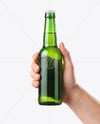 Green Glass Beer Bottle in a Hand Mockup