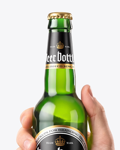 Green Glass Beer Bottle in a Hand Mockup