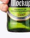 Green Glass Beer Bottle in a Hand Mockup