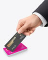 Hand with Matte Paper Business Card Mockup