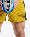 Man Wearing Rugby Uniform with Ball Mockup