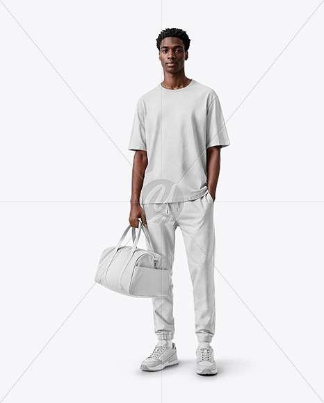 Man Wearing T-Shirt and Sweatpants Holding Duffle Bag Mockup