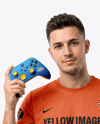 Man with Game Controller Wearing eSports Jersey Mockup