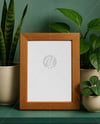 Wooden Framed Poster on Shelf with Plants Mockup
