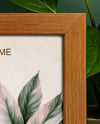 Wooden Framed Poster on Shelf with Plants Mockup