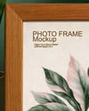 Wooden Framed Poster on Shelf with Plants Mockup