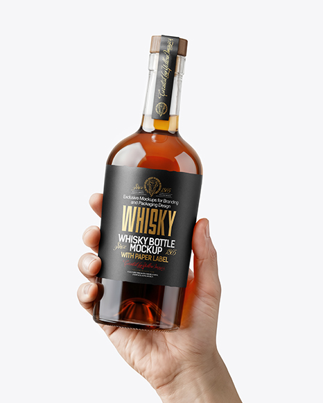 Whisky Bottle in a Hand Mockup