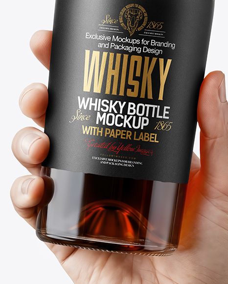 Whisky Bottle in a Hand Mockup