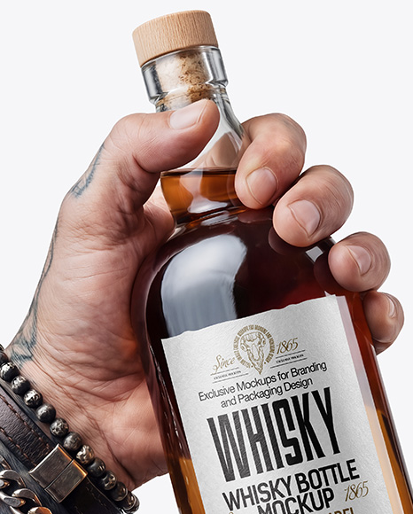 Whisky Bottle in a Hand Mockup