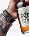 Whisky Bottle in a Hand Mockup
