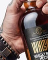 Whisky Bottle in a Hand Mockup