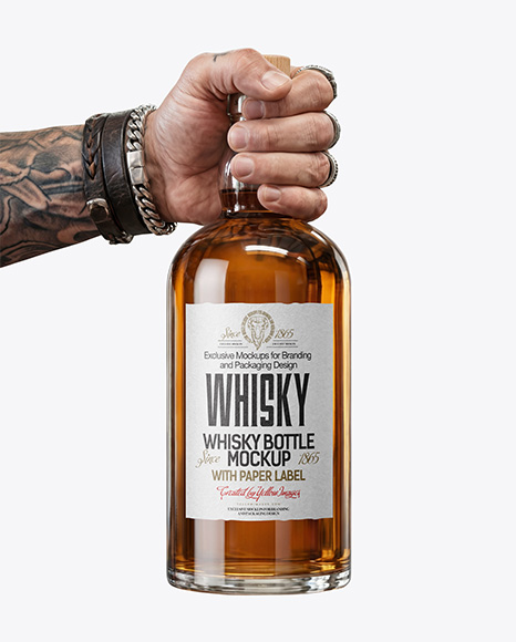 Whisky Bottle in a Hand Mockup