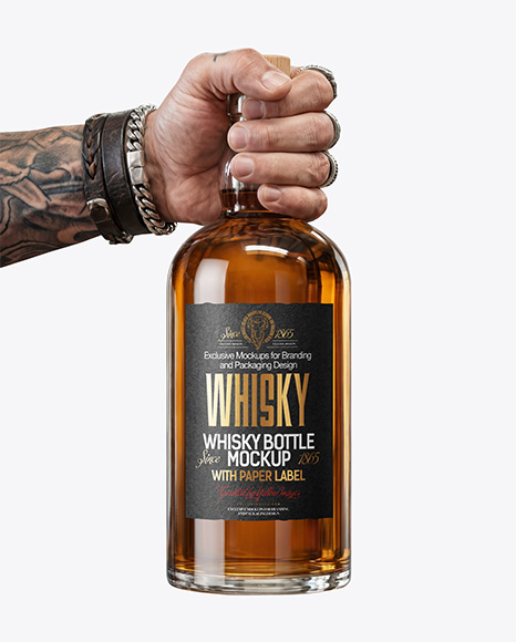 Whisky Bottle in a Hand Mockup
