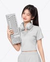 Woman Wearing Cropped Polo Shirt with Gaming Keyboard Mockup