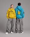 Young Couple Wearing Oversized Hoodie Mockup