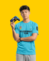 Young Asian Man with Game Controller Wearing eSports Jersey Mockup