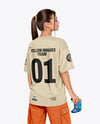 Young Woman with Game Controller Wearing eSports Jersey Mockup
